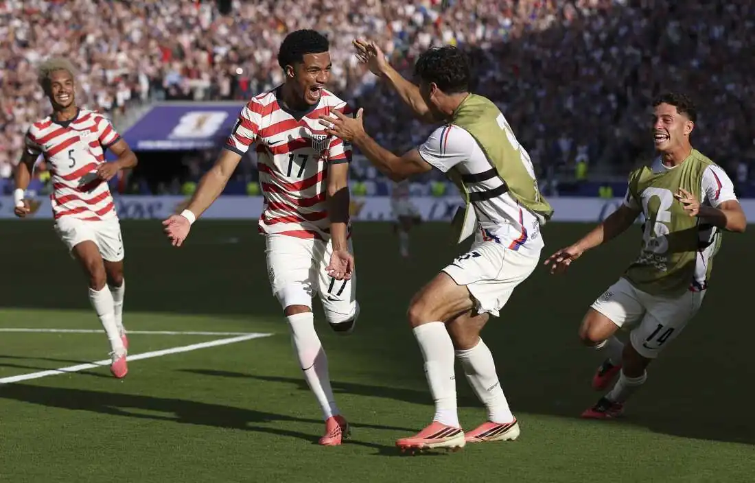 United States players regroup after the Balogun red card against Bosnia-Herzegovina
